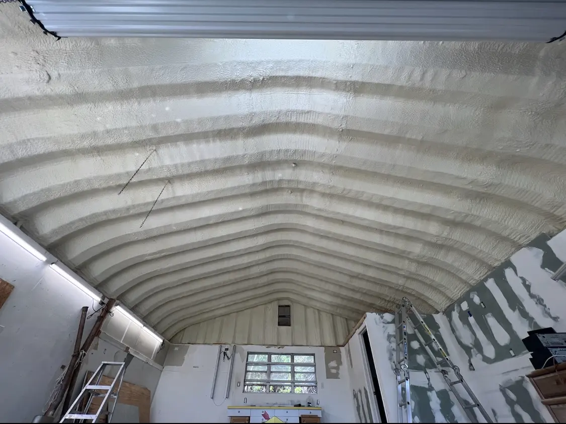 Spray polyurethane foam applied to the underside of a metal roof deck in Ridgefield Park village